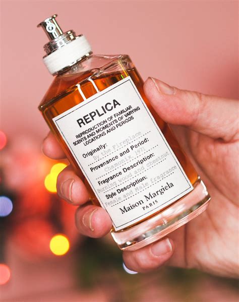 replica perfume in hand|replica perfume by the fireplace.